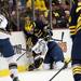 Michigan freshman defenseman Jacob Trouba checks Notre Dame defenseman Robbie Russo on Sunday, March 24. Daniel Brenner I AnnArbor.com